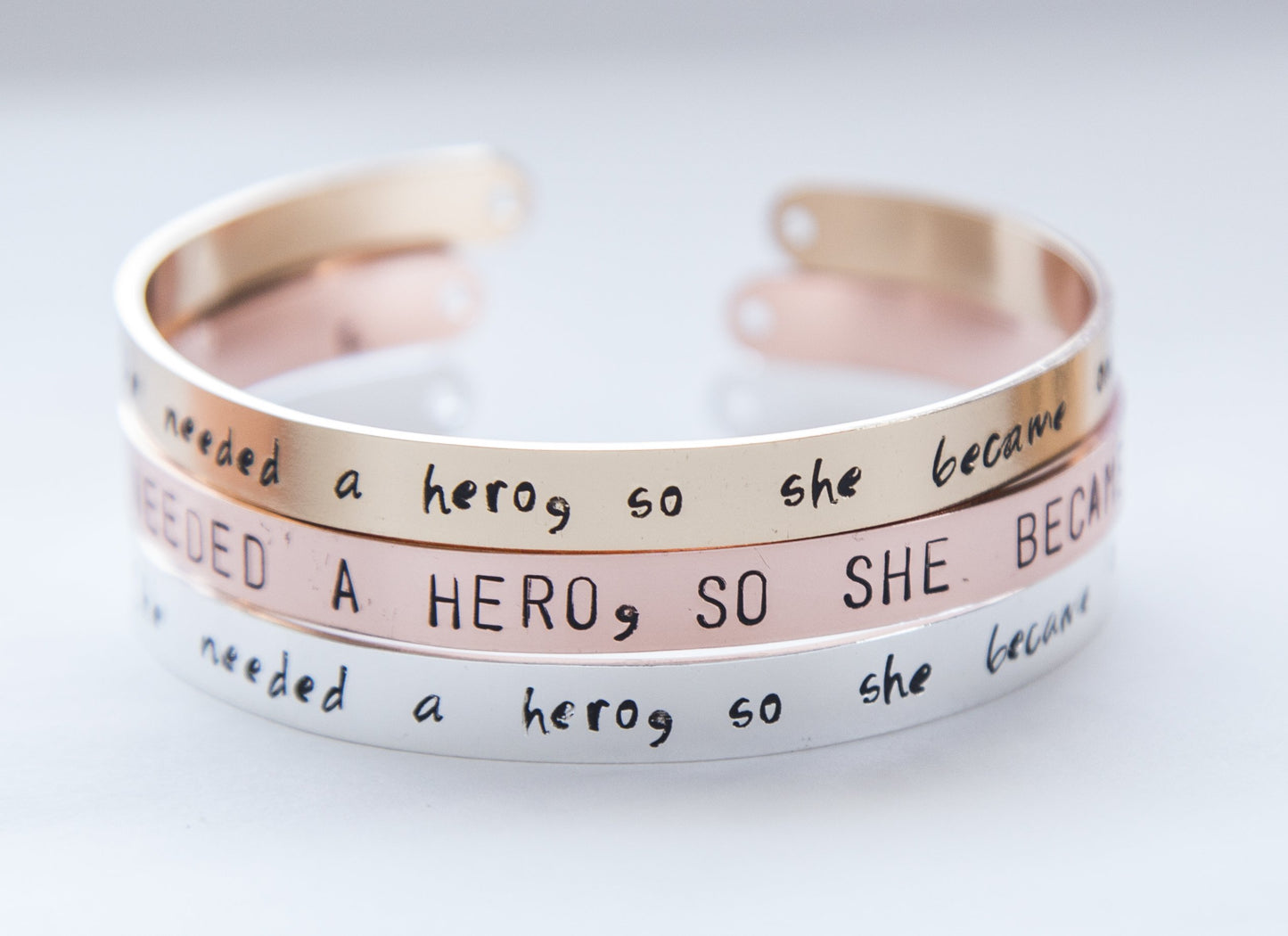 She needed a hero, so she became one, hand stamped cuff, silver/gold